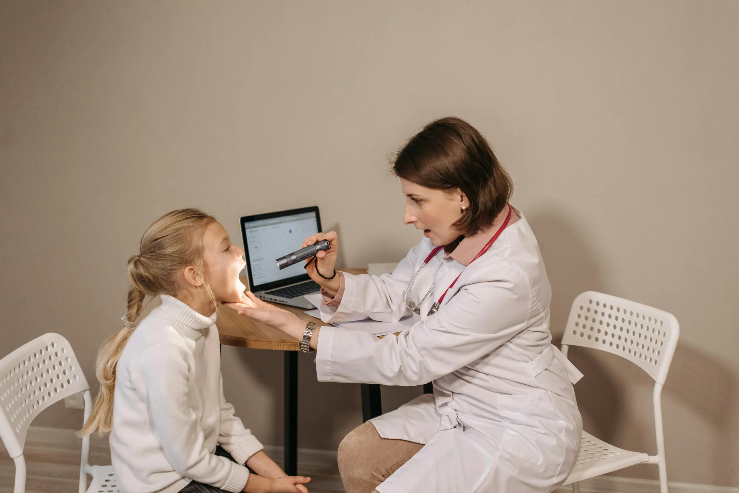 Child getting looked at by doctor 