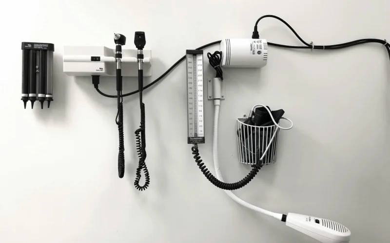 When to visit Urgent Care - picture of doctors tools sitting on the wall